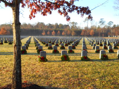 Wreaths on cemetery grave stones